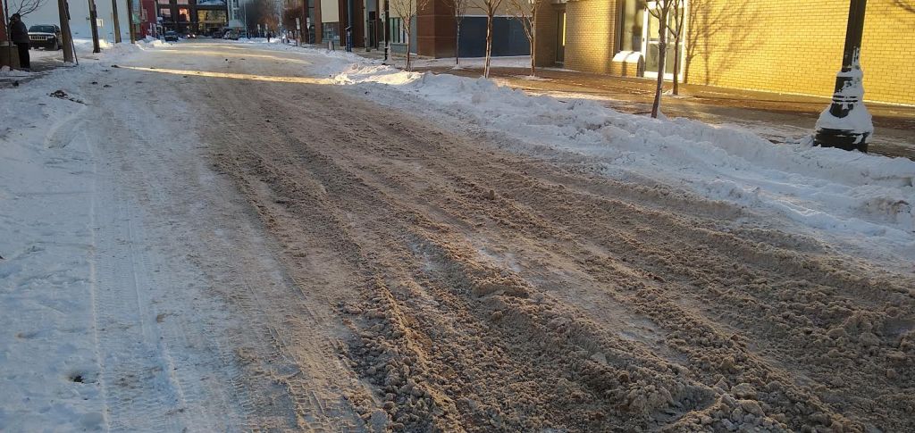A road covered in brown slush